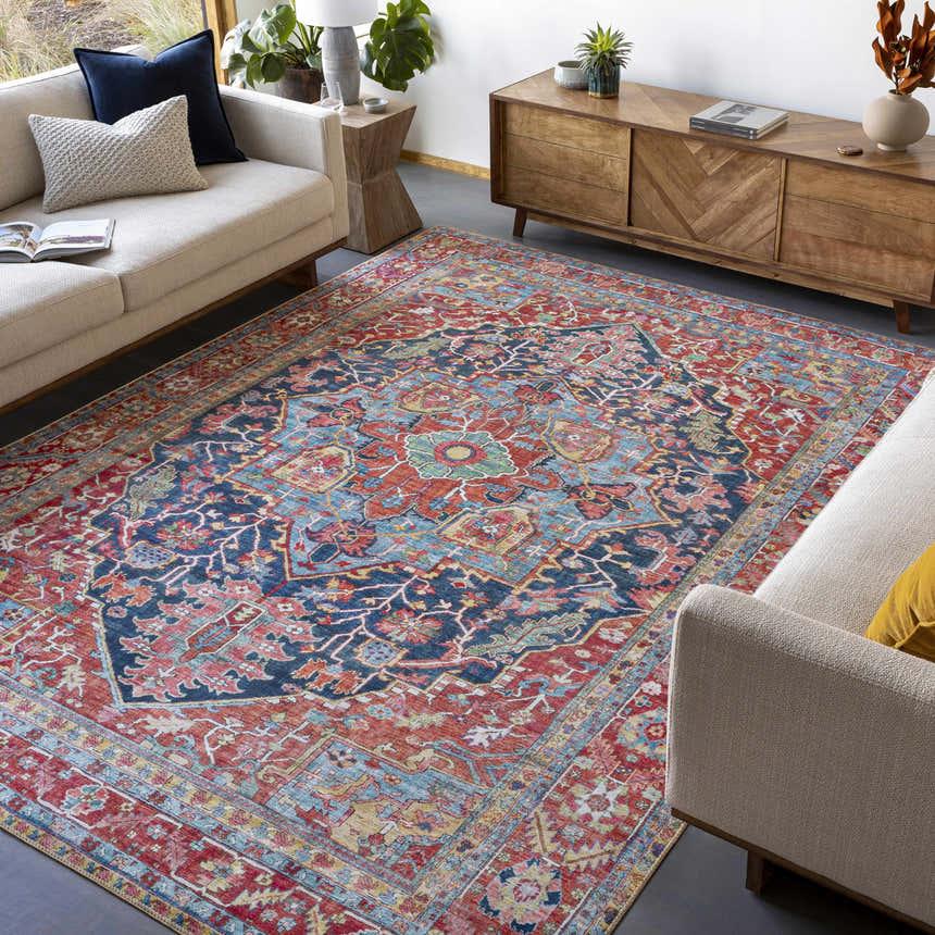 Living room scene with Pauline Red Medallion Performance Rug, sofas, and wood cabinet. Traditional style with burgundy, blue, and cream colors. Roomscene-Rectangle