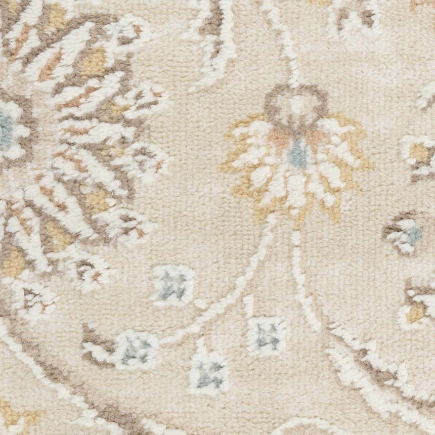 Close-up of the Nourison Isla Ivory Vintage Area Rug showing the high pile, floral pattern, and chestnut color details.