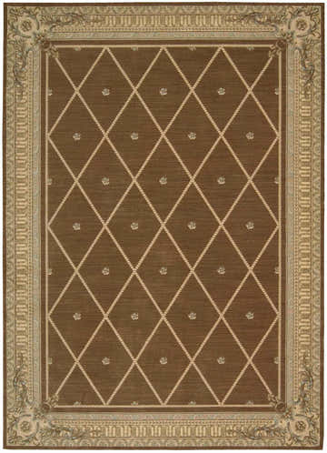 Close-up of the Nourison Ashton House Mink Vintage rug. Features a diamond pattern and floral border.