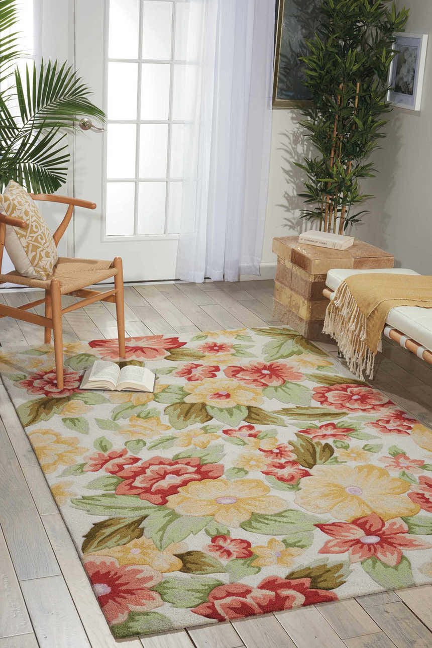 Sunlit room with a Nourison Fantasy Cream rug featuring a floral pattern in red, yellow, and green. Farmhouse style.