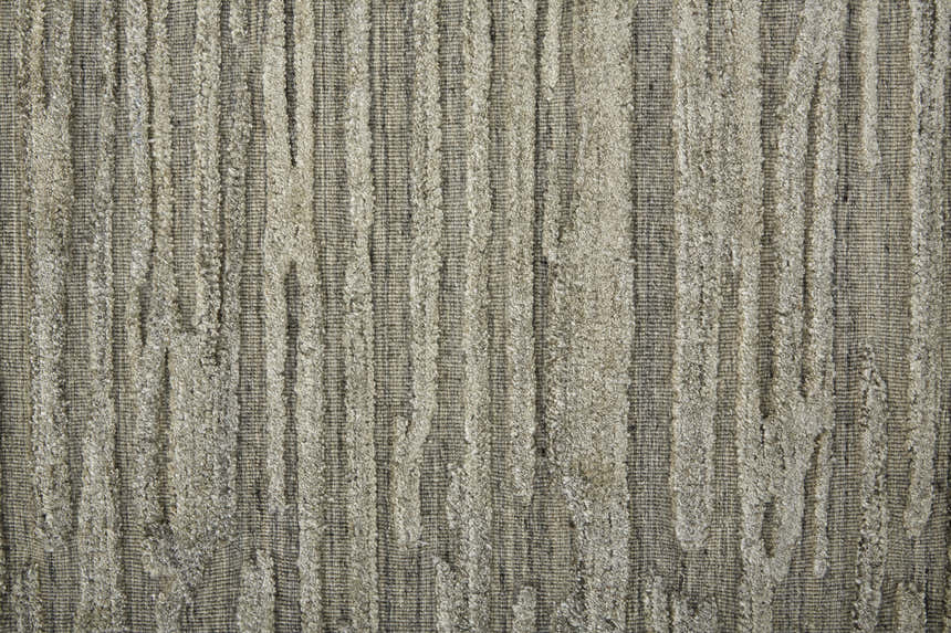 Close-up of the Feizy Braeside Transitional Abstract rug. Taupe and gray wool and viscose with a textured, vertical stripe design. Texture