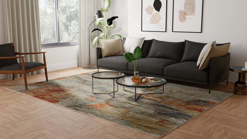 Living room scene with a gray sofa and Feizy Jaxson Gray/Orange/Ivory Area Rug. Modern abstract design. Roomscene-Rectangle