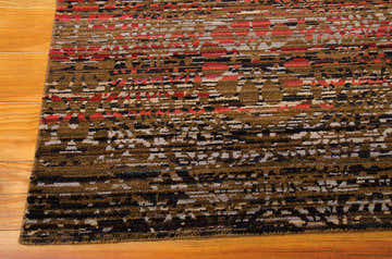 Close-up of the Nourison Rhapsody Multicolor Indoor Area Rug showing the abstract pattern and wool texture.