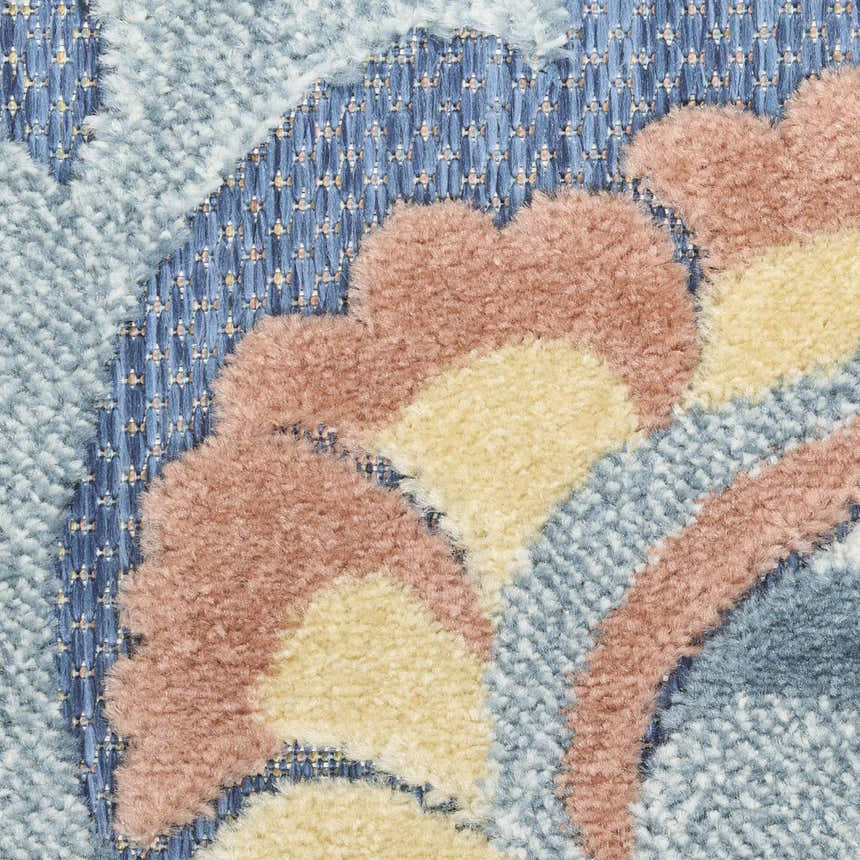 Close up of the Nourison Aloha Blue Rose Farmhouse Area Rug showing blue, rose, and yellow floral pattern.