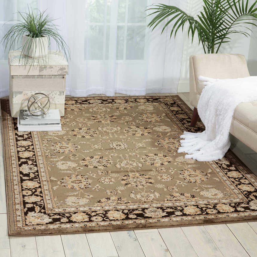 Living room scene with a grey Nourison Ararat Persian rug, neutral armchair, and light wood floors.