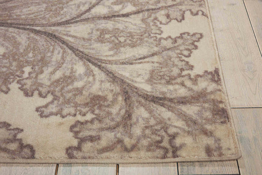 Close-up of Nourison Utopia Ivory Floral Indoor Area Rug featuring a chestnut floral pattern on a soft ivory background.
