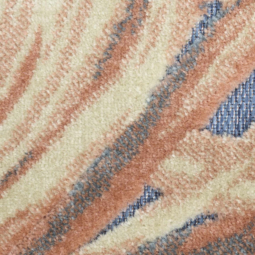 Close-up of Nourison Aloha Blue Rose rug showing its pile texture and abstract pattern in rose, beige, and blue.