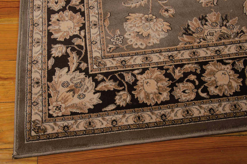 Close up of the Nourison Ararat Grey Persian rug showing floral pattern and border detail.