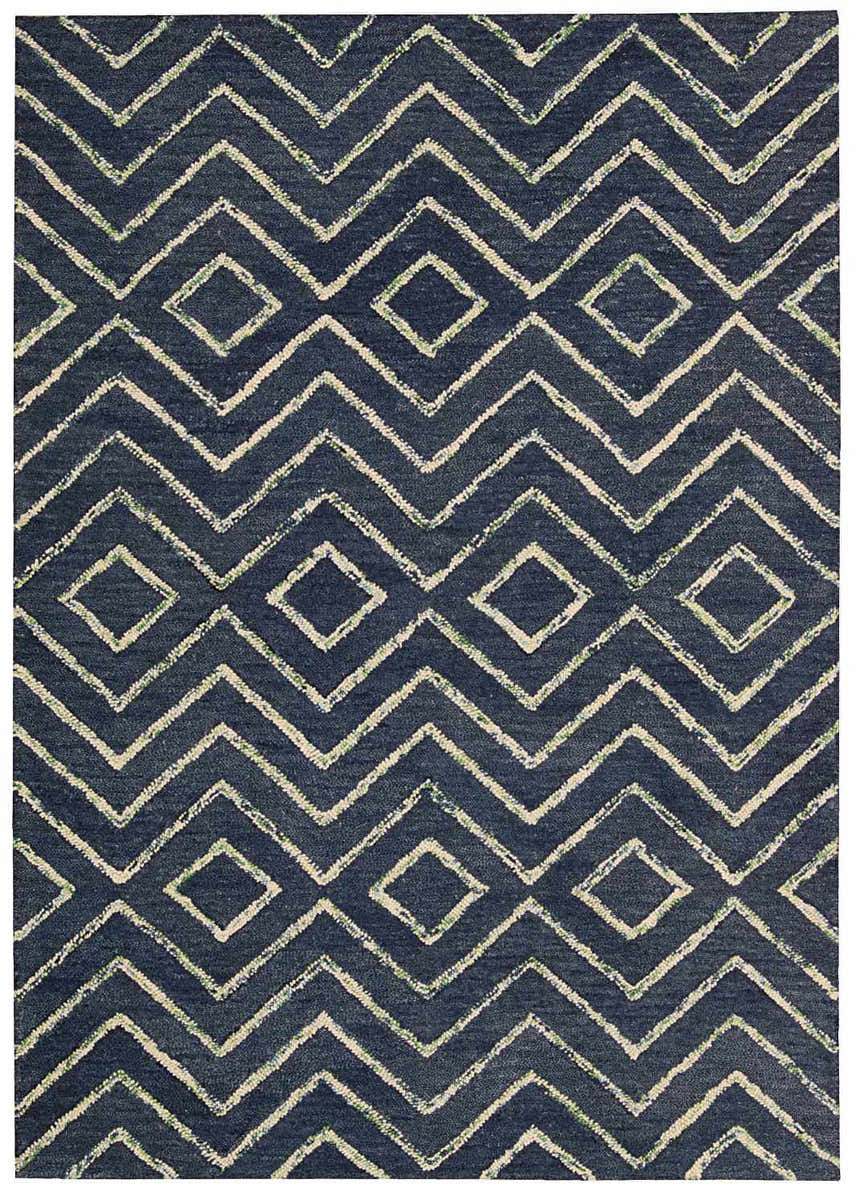 Close-up of the Barclay Butera Intermix Storm rug. Navy wool rug with a geometric diamond and chevron pattern.