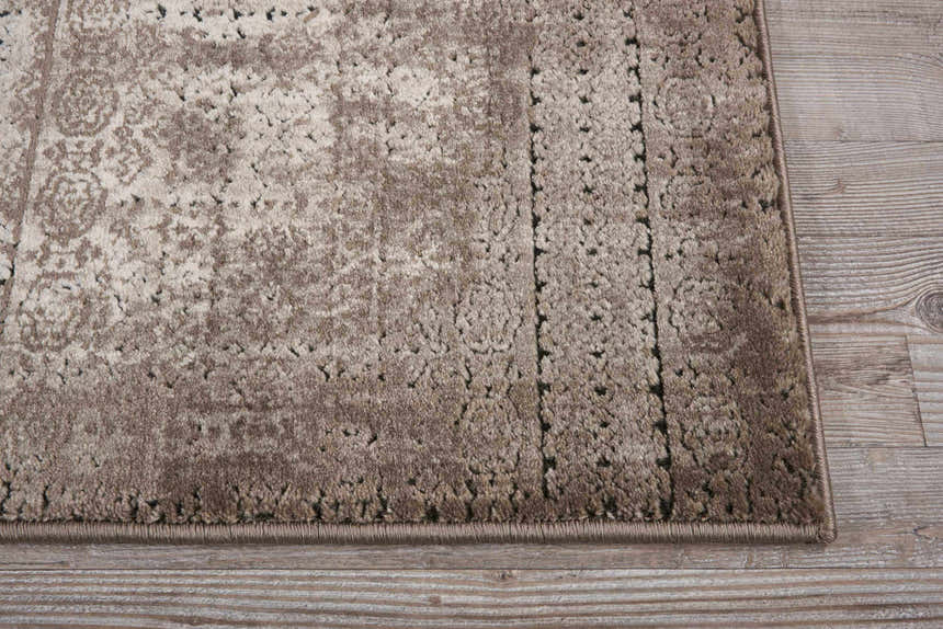 Close-up of the Ash Nourison Karma rug showing its vintage design, texture, and neutral color palette.