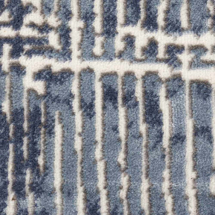 Close-up of Nourison Urban Decor Slate/Ivory rug. Modern design with slate blue and ivory geometric pattern and soft texture.