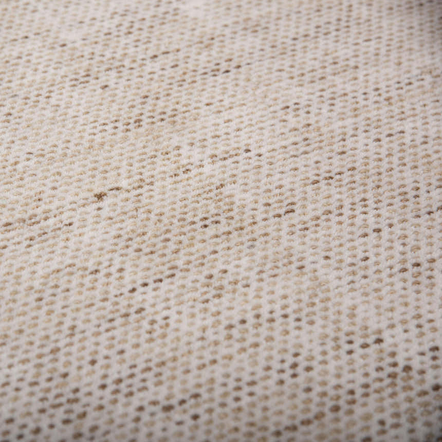 Close-up of the hand-loomed Rizzy RMI677 area rug, beige and light brown tone on tone wool texture. Texture