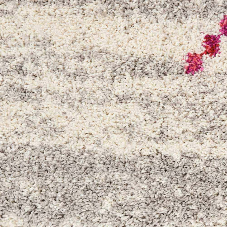 Close up of the cream and grey tribal pattern on the Nourison Nomad area rug.