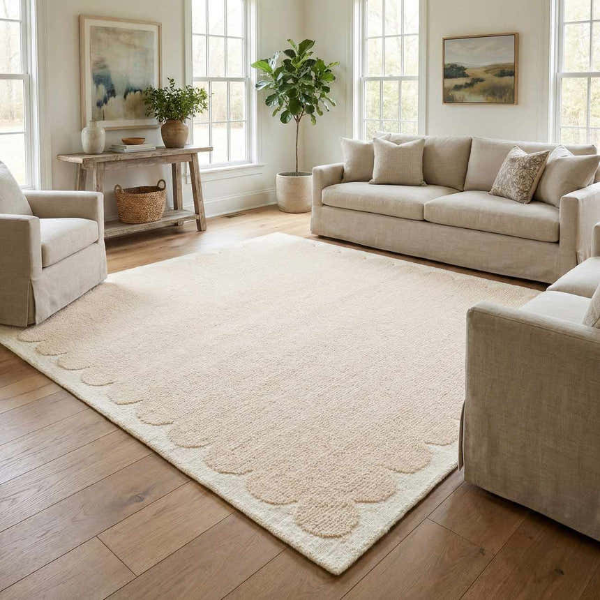 Living room scene with a beige Lytufa Modern Art Deco rug, cream sofa, and natural light from large windows. Roomscene-Rectangle