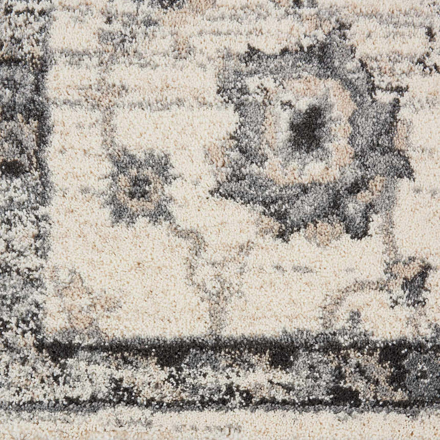 Close up of the Nourison Fusion Cream Grey Vintage Area Rug, showing the vintage pattern and soft texture.