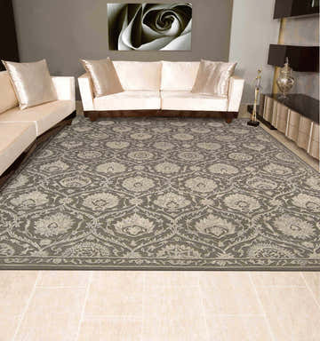 Living room with a beige sofa and the Nourison Regal Cobblestone Persian rug in cobblestone color.