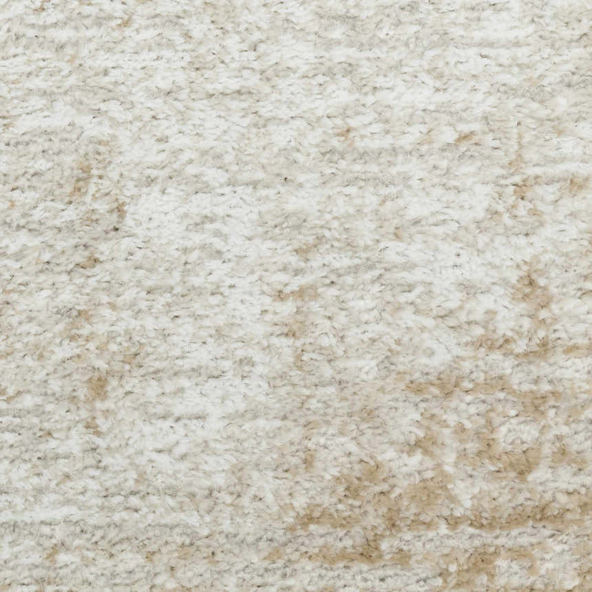 Close-up of the high pile Nourison Dekor Ivory Beige rug, showing chestnut color variations and soft texture.