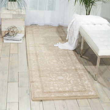 Light, airy room scene with a Nourison Symphony Ivory runner rug, white bench, and wood floors.