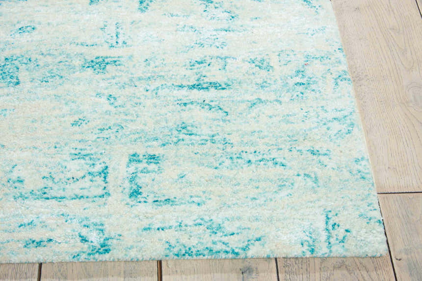Close-up of the Nourison Gemstone Jade rug showing its abstract, textured pattern and soft jade and cream colors.