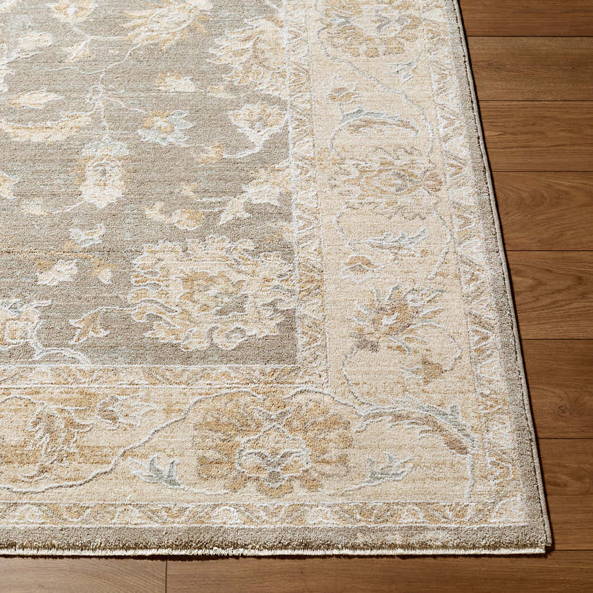 Close-up of the Vintage Edit Rachel Zoe x LIVABLISS RZVE-2302 Area Rug. Beige, cream, and gray floral pattern. Corner