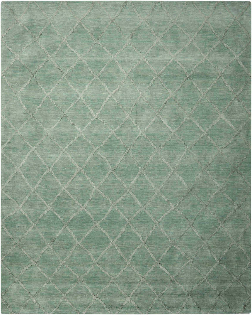 Close-up of the Nourison Lunette Aqua rug featuring a diamond trellis pattern and soft wool texture.