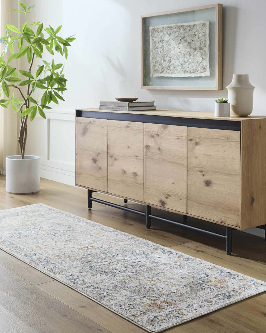 Living room scene with wood floors and the Ivria Blue Gray Area Rug runner in front of a wooden console table. Roomscene-Runner