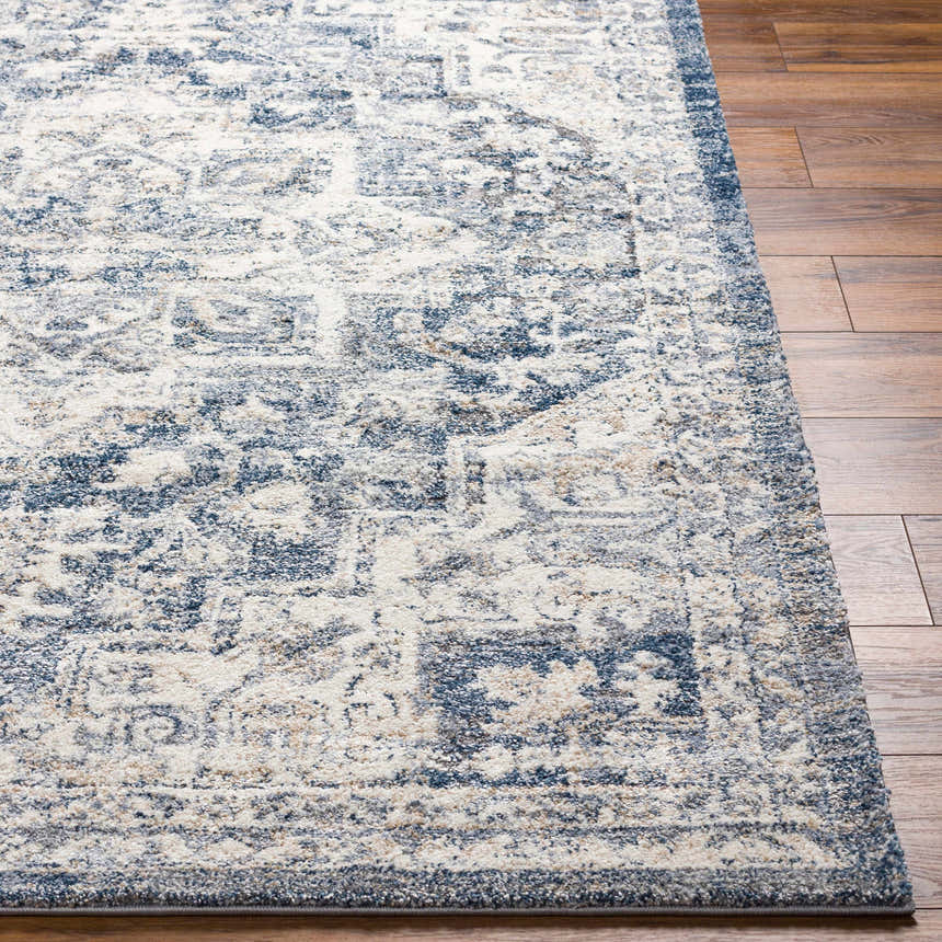 Close up of the Shotts Thick Luxe Rug in cream and dark blue on hardwood floor. Front