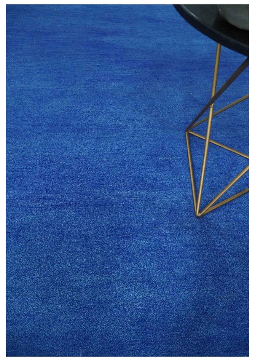 Custom made solid Blue Woolen Hand Tufted contemporary area Rug