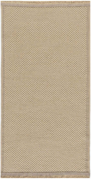 Close-up of the Nourison Jute Natural rug. Neutral jute with a subtle woven dot pattern and fringed edge.