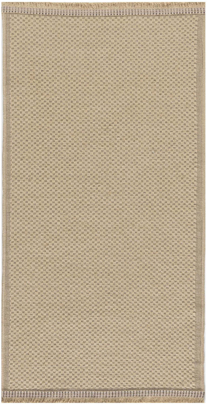 Close-up of the Nourison Jute Natural rug. Neutral jute with a subtle woven dot pattern and fringed edge.