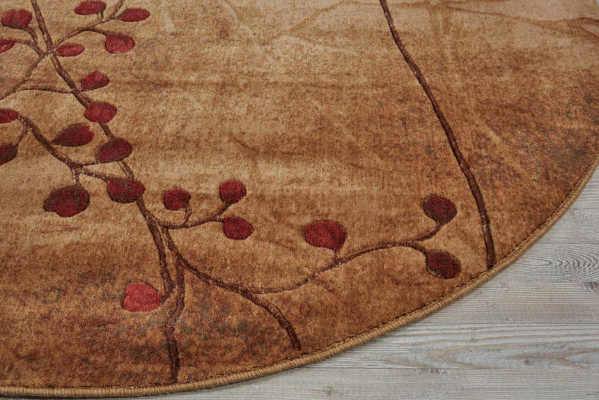 Close-up of Nourison Somerset Latte rug showing latte color and red leaf design. Southwestern style.
