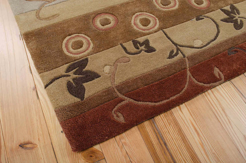 Close-up of Nourison Contour Multicolor rug showing floral and circle patterns in beige, brown, and rust hues.