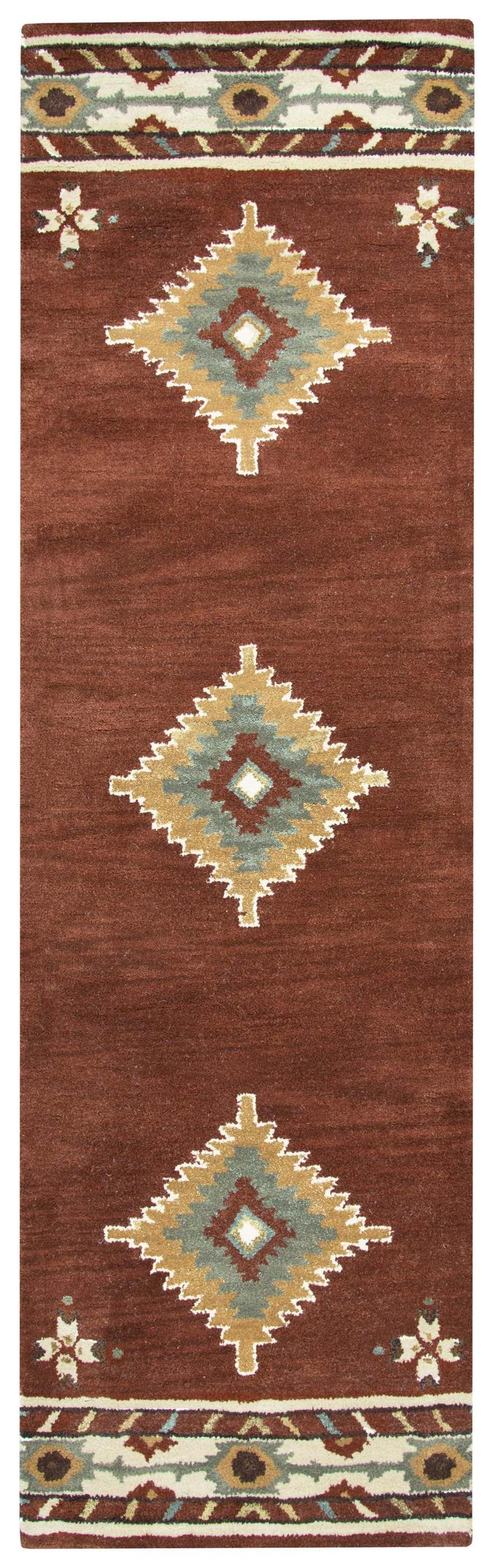 Close-up of Rizzy SU1822 runner rug. Hand-tufted wool rug in Southwestern style with diamond and floral motifs in red, tan, sage, and off-white. Design-Runner