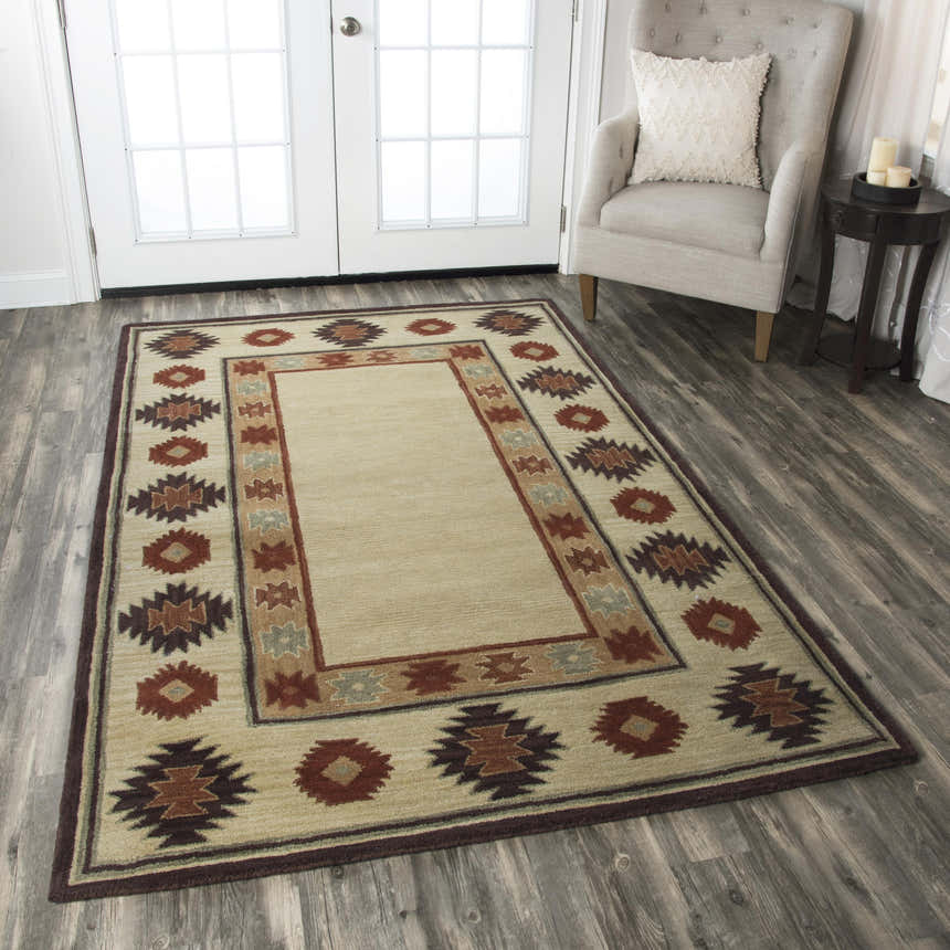 Living room scene with Rizzy SU2015 area rug. Beige Southwestern rug with burgundy and navy accents. Roomscene-Rectangle