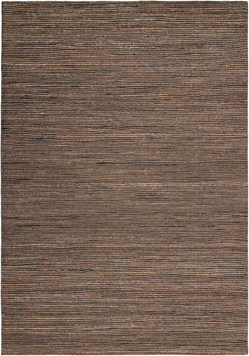 Close-up of Calvin Klein Monsoon Cinnamon rug. Handmade jute and wool felt rug with a horizontal striped texture in dusty coral hues.