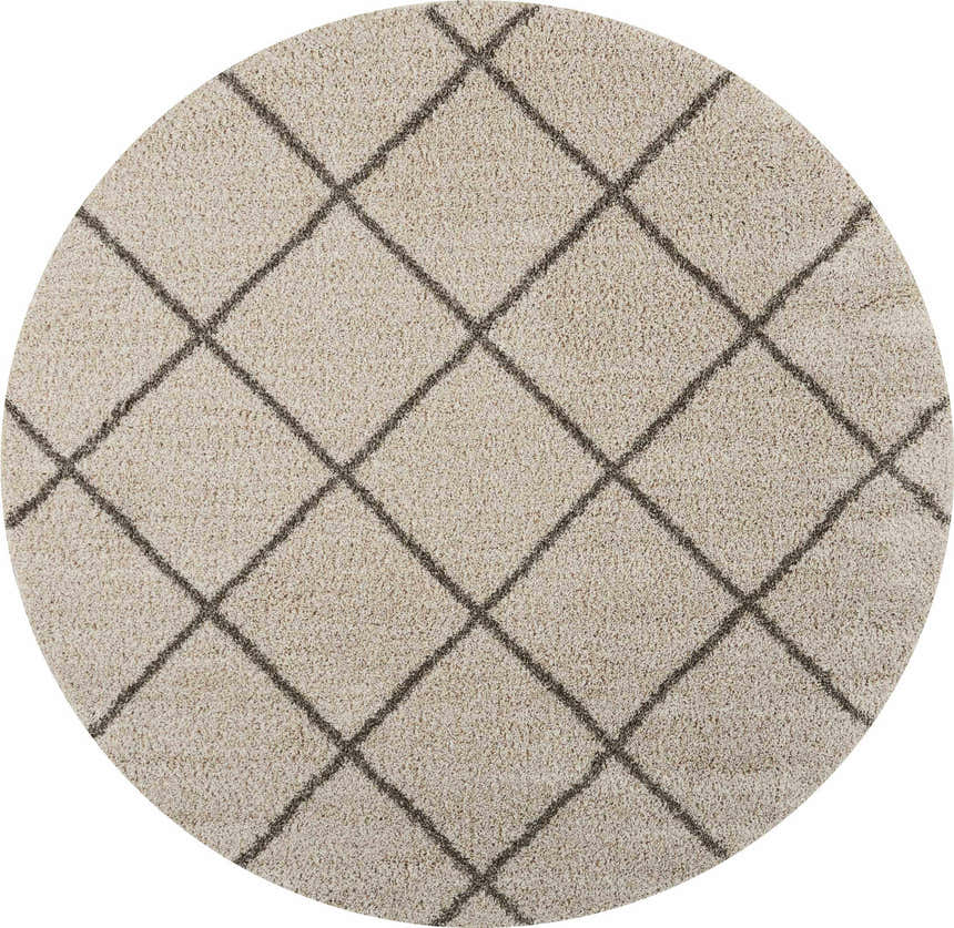 Close-up of a round Nourison Brisbane Cream Shag rug. Features a plush shag texture and a dark gray diamond pattern.