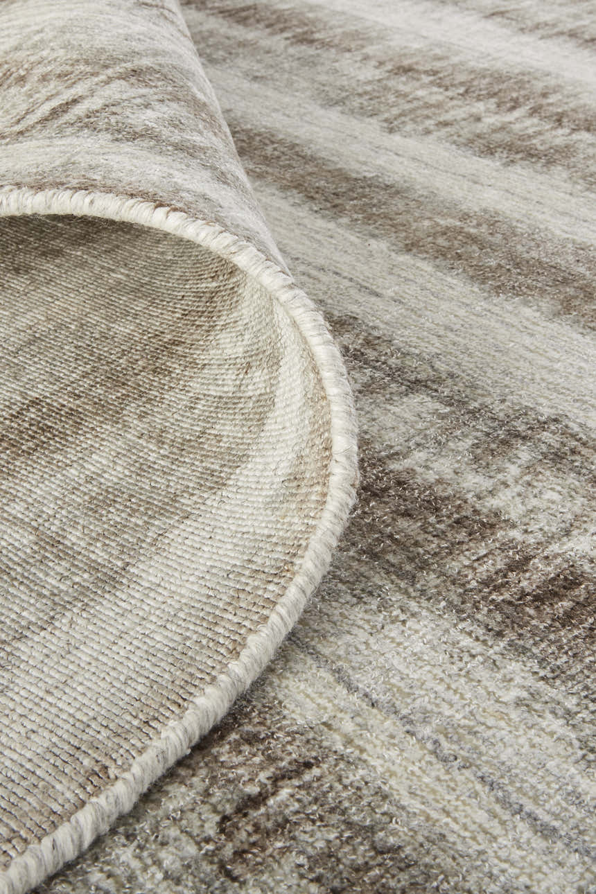 Close-up of Feizy Mackay Tan/Ivory/Brown Area Rug showing hand woven texture and striped pattern. Casual, transitional style. Fold