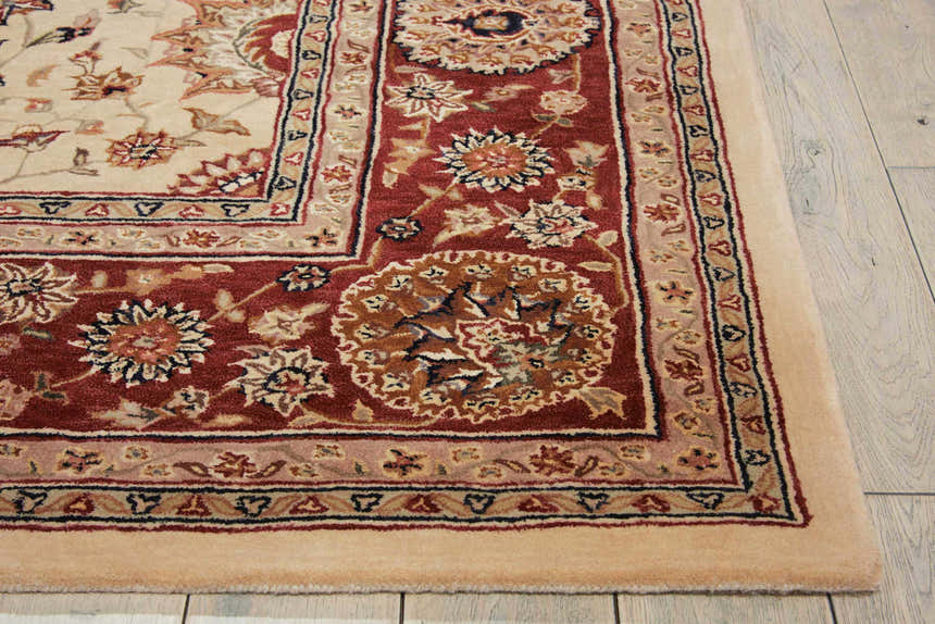 Close-up of the handmade Nourison 2000 Ivory Persian rug. Chestnut and ivory floral design with a detailed border.
