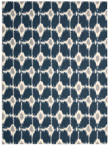 Close-up of Nourison Enhance Navy rug. Features a geometric ikat pattern in navy, gray, and cream. Machine-made polyester rug.