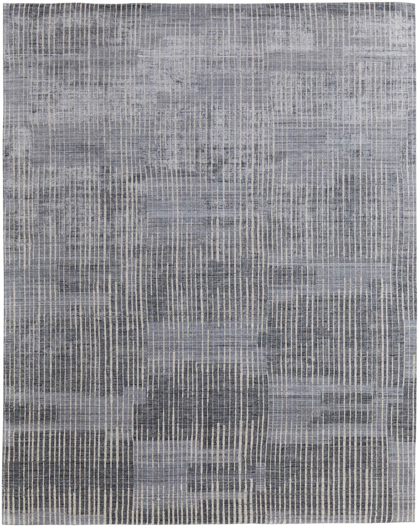 Close-up of Feizy Eastfield rug. Modern abstract grid design in blue, ivory, and gray. Distressed pattern, hand woven texture. Design-Rectangle
