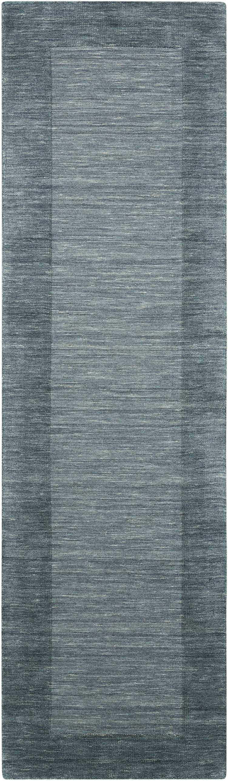 Close-up of Barclay Butera Ripple Spa runner rug. Handmade wool rug in spa blue, with subtle border detail.