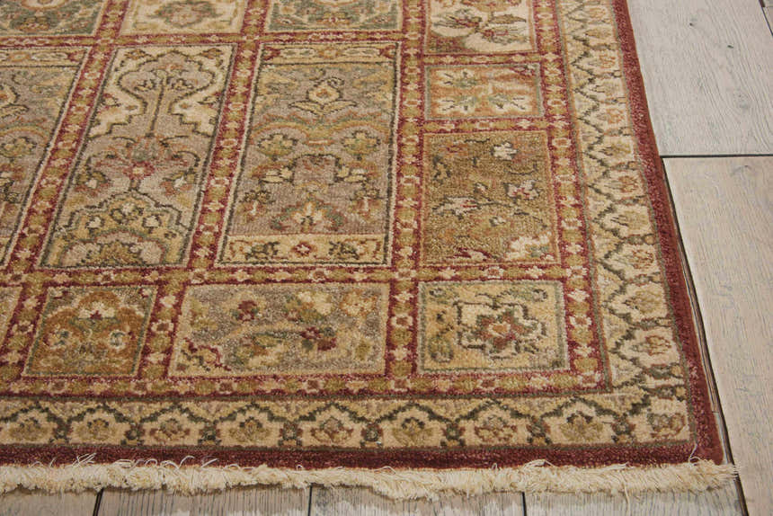 Close-up of the handmade Nourison Legend Multicolor Persian rug. Features a rectangle design, wool texture, and fringe.