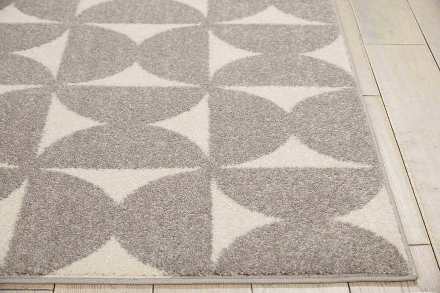 Close-up of Nourison Harper Grey Colorful rug showing geometric half-circle pattern and soft texture.