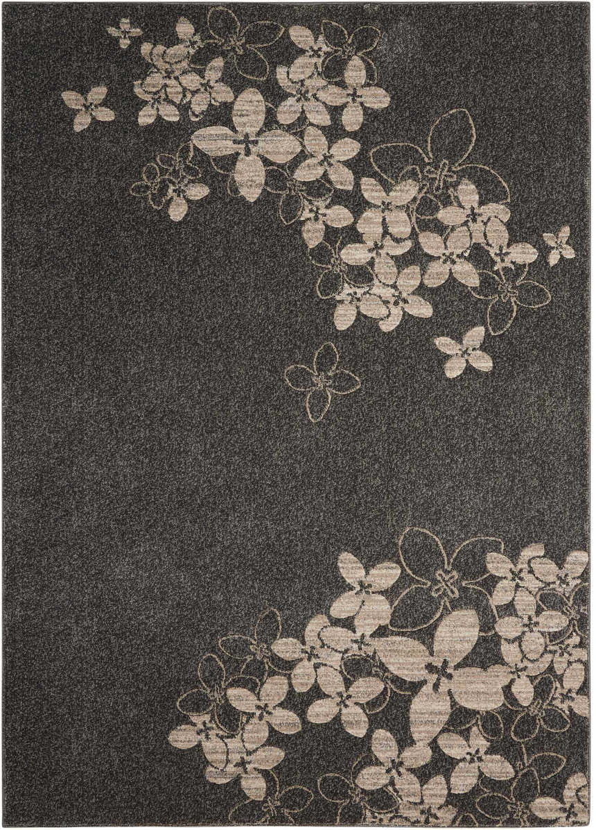 Close-up of Nourison Maxell Charcoal rug. Contemporary style with taupe floral pattern on a dark gray, textured background.