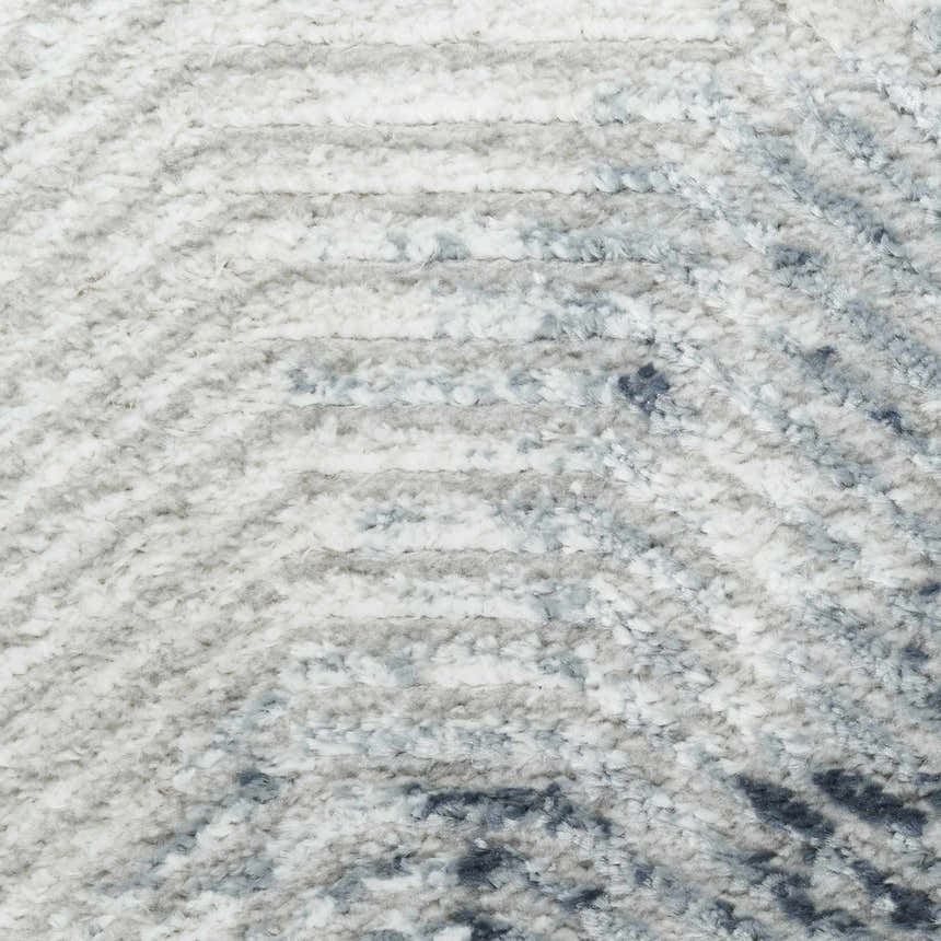Close up of the high pile Nourison Dekor Grey Navy rug showing texture and pattern.