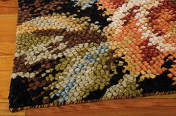 Close-up of the handmade Nourison Impressionist Harvest Floral rug. Wool rug with harvest colors and floral design.