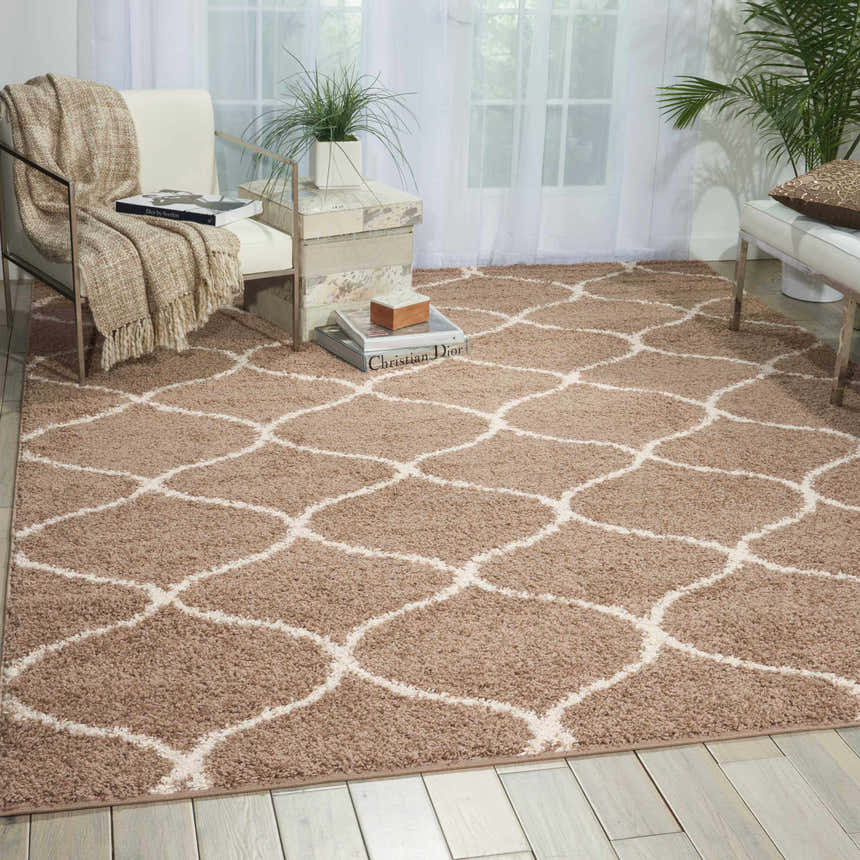 Living room scene with a Nourison Windsor Cappuccino Shag Rug, white furniture, and natural light.