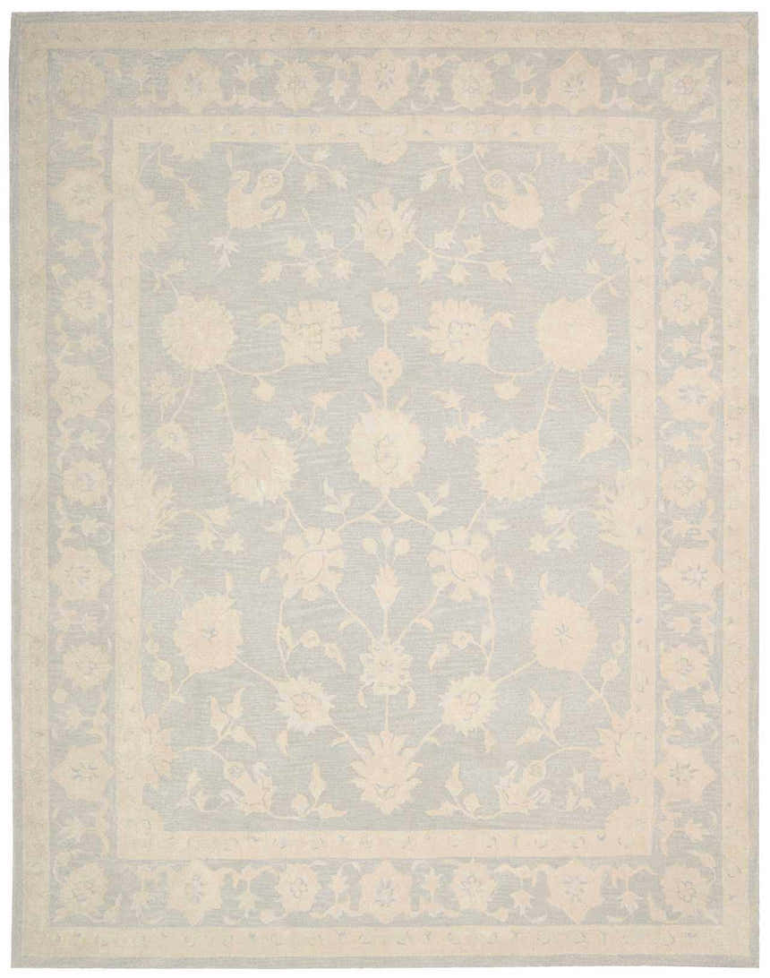 Close-up of the Nourison Zephyr Light Blue rug, featuring a floral pattern and border in soft, muted tones.