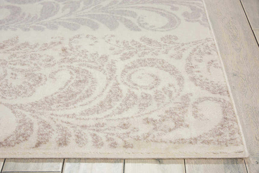 Close-up of the Nourison Utopia Ivory Floral Indoor Area Rug, showcasing its chestnut floral pattern and soft texture.