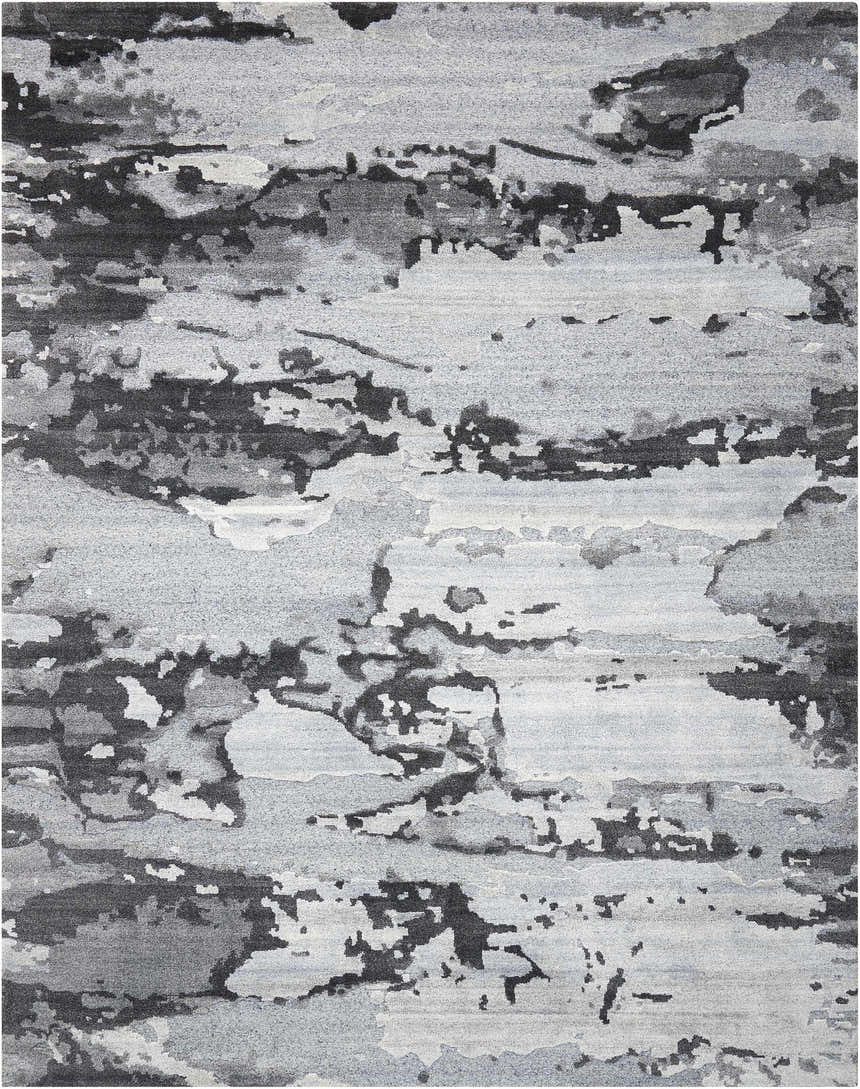 Close-up of the Nourison Divine Smoke Modern Indoor Area Rug, featuring a gray abstract pattern and luxcelle texture.